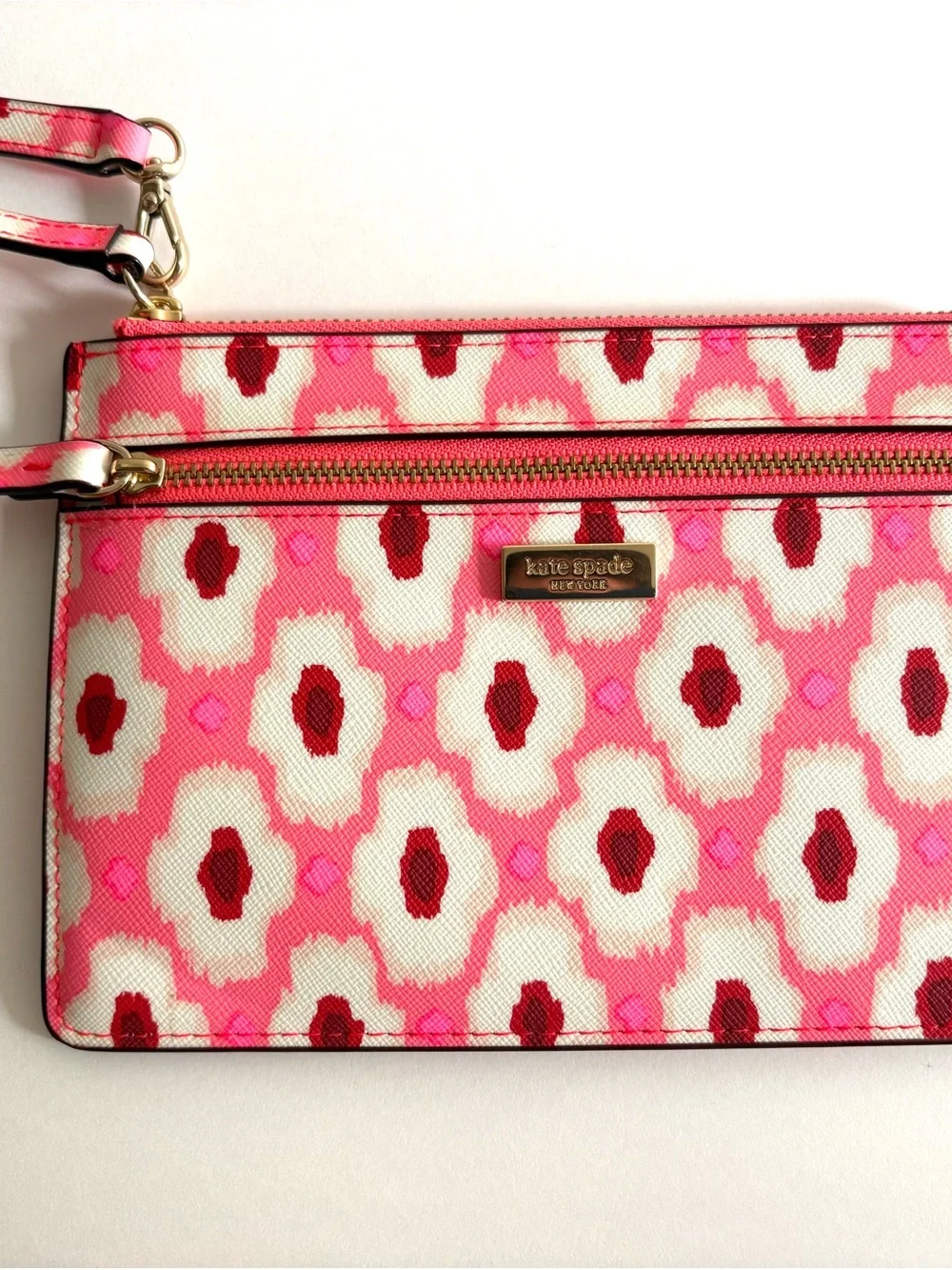 kate spade pink and white patterned wristlet clutch with gold hardware